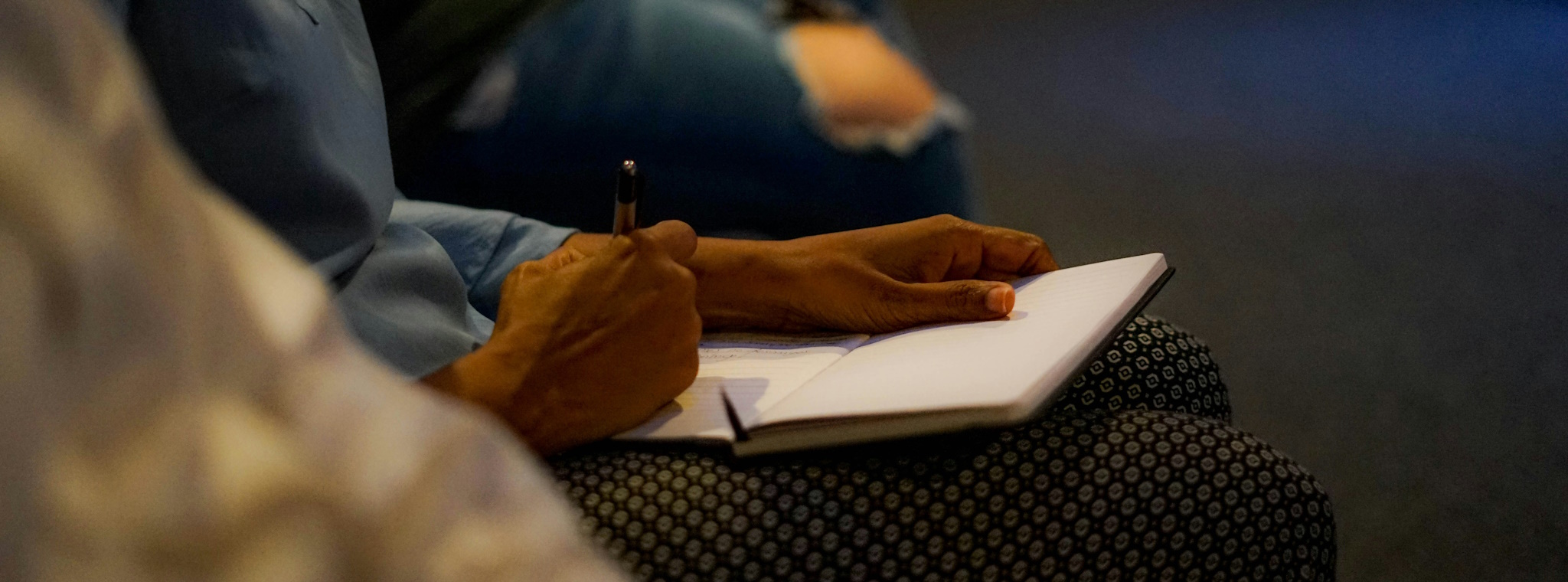 Person taking notes at a sermon.